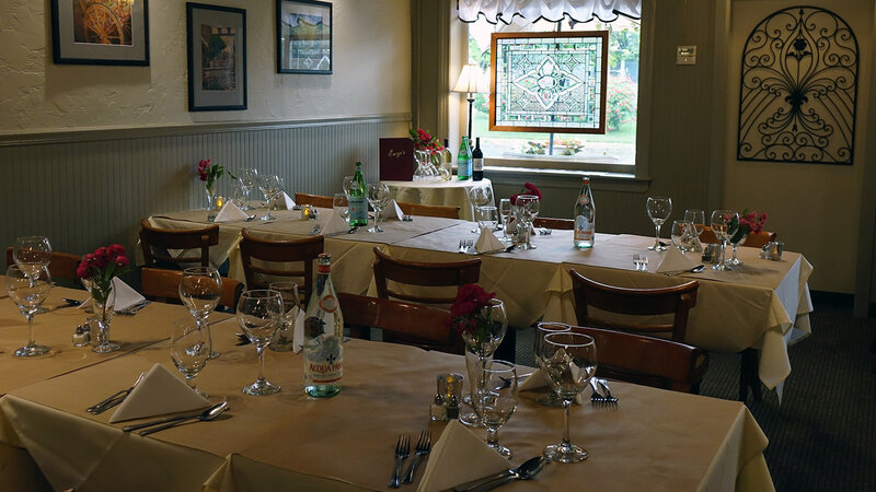 Dining room with long tables set for private event