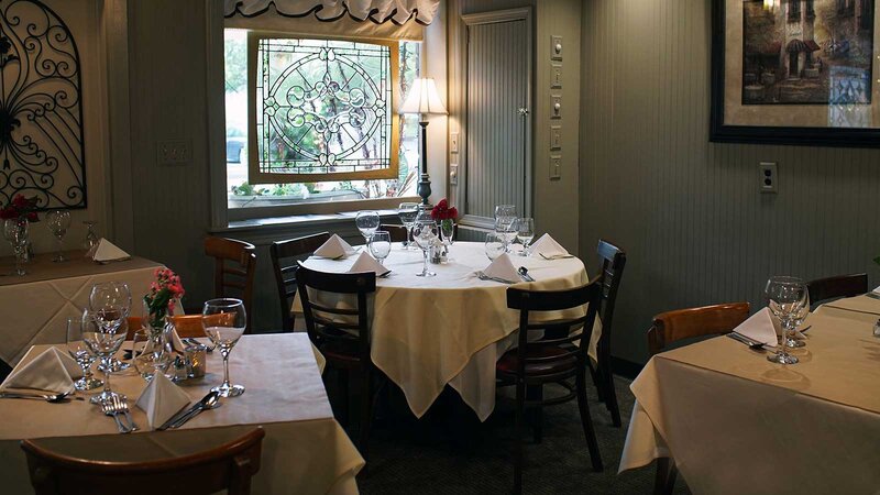 Dining room with focus on round table set for six