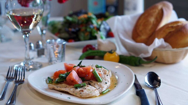 Chicken topped with diced tomatoes